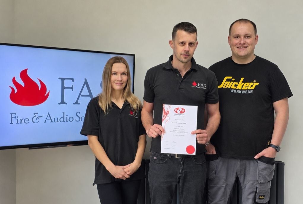 Fire & Audio Solutions team holding Fire Industry Association membership certificate