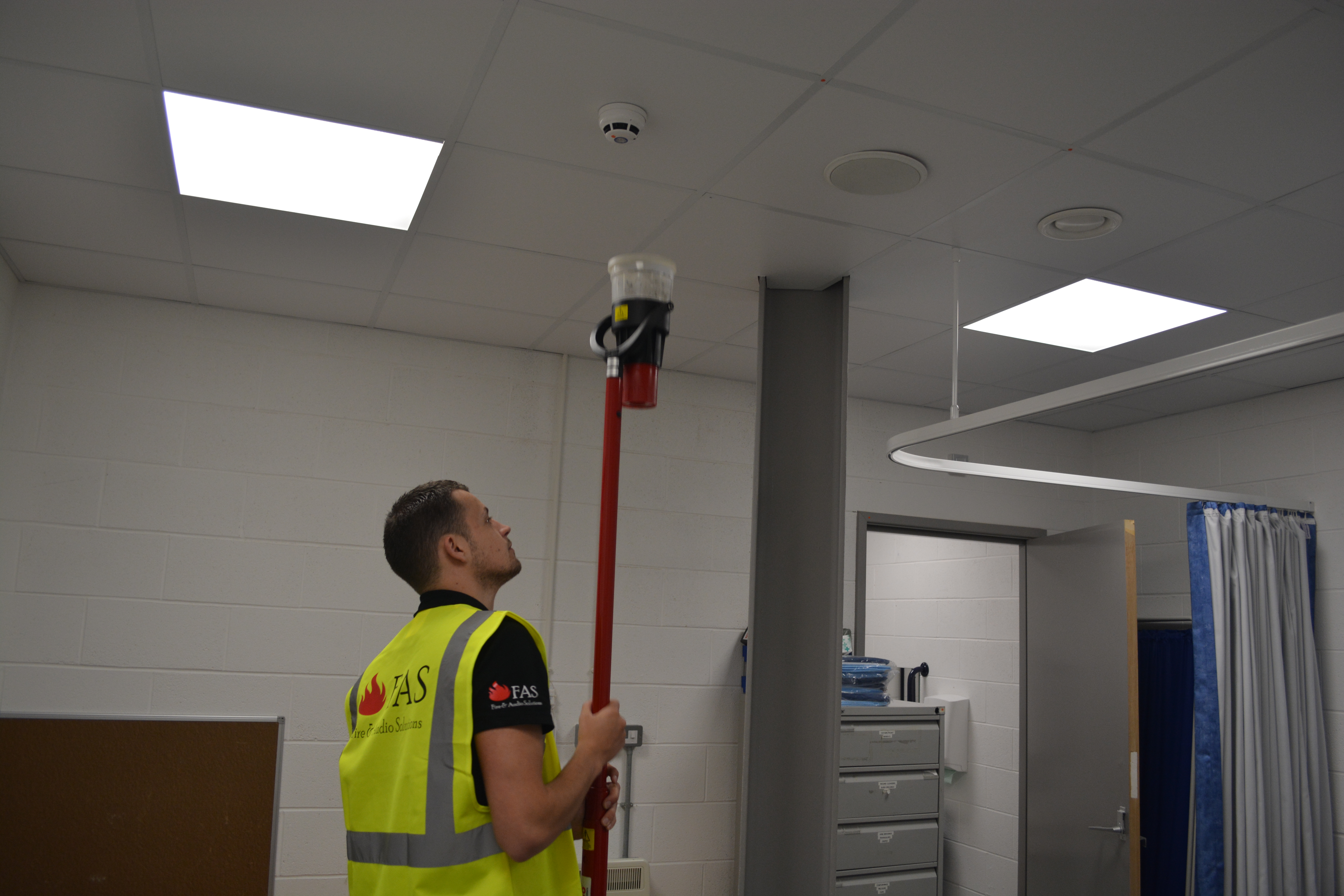 Fire alarm maintenance work being carried out on site