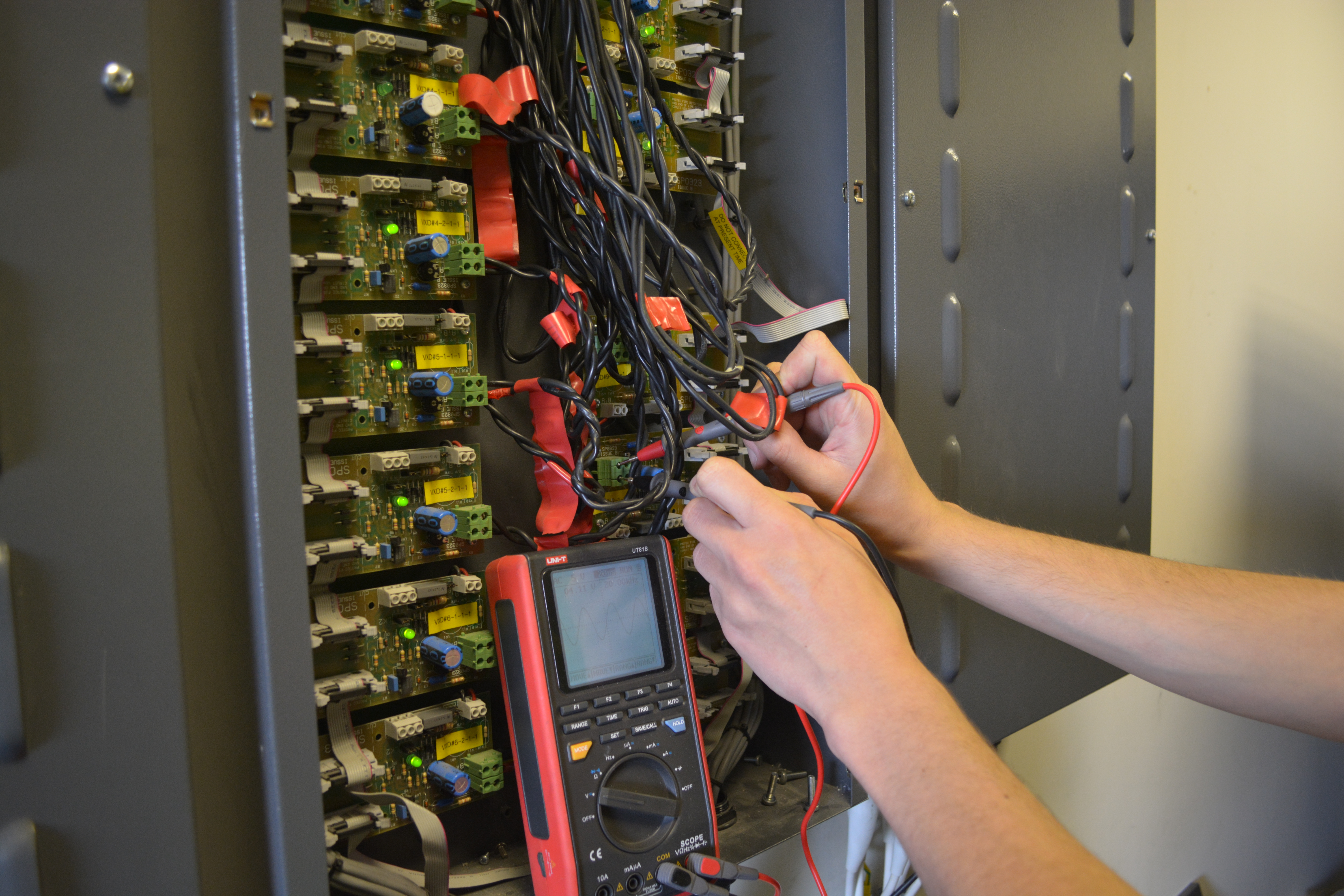 Engineer carrying out repair or remedial fire alarm work